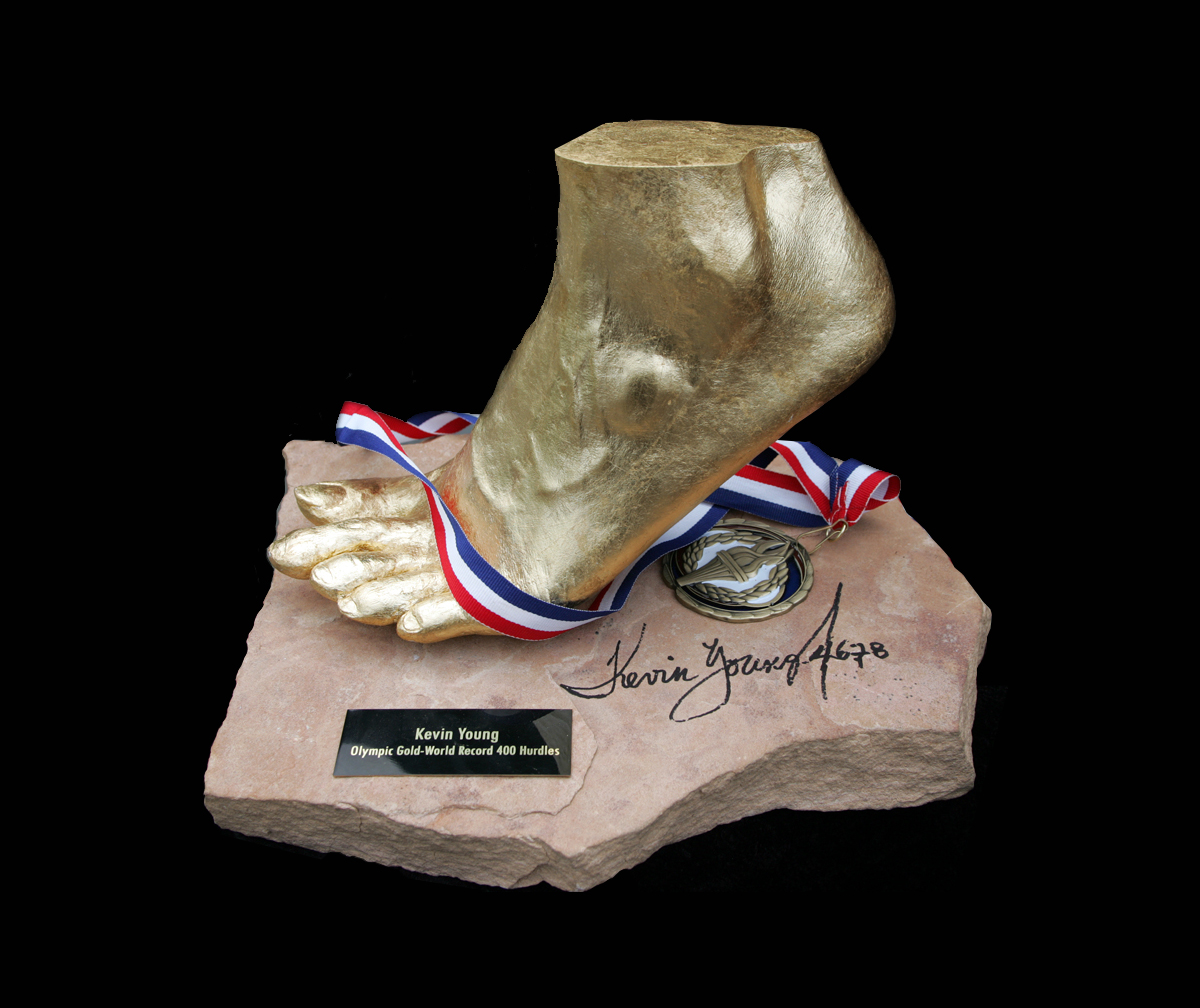 Golden foot sculpture of Kevin Young, crafted by Grace Irene, commemorating his historic 400m hurdles world record set at the 1992 Barcelona Olympics.