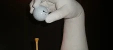 Custom Golf Hand Cast Sculpture by Keepsakes of Triumph White plaster hand-cast sculpture of a golfer's hand teeing up a golf ball, custom art piece by Keepsakes of Triumph