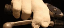 Custom Motorcycle Rider Hand Cast Sculpture by Keepsakes of Triumph Hand-cast plaster sculpture of a motorcyclist's hand gripping the throttle and brake lever, custom keepsake by Keepsakes of Triumph