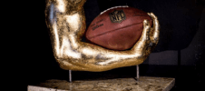 NFL Football Hand Cast Sculpture for Ka'Deem Carey Custom hand-cast sculpture of NFL running back Ka'Deem Carey's hand cradling a football, finished in gold patina by Keepsakes of Triumph